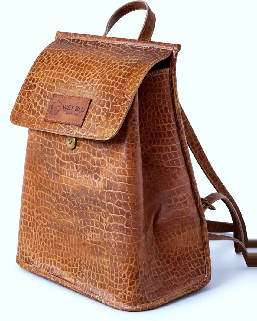 Safari backpack in tan croc-embossed leather with WetBlu patch
