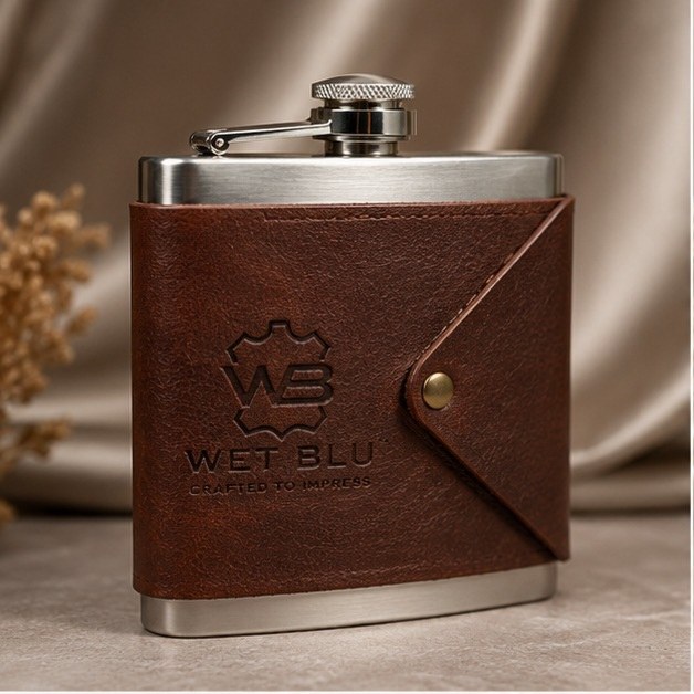 Steel hip flask wrapped in brown leather with embossed WetBlu logo